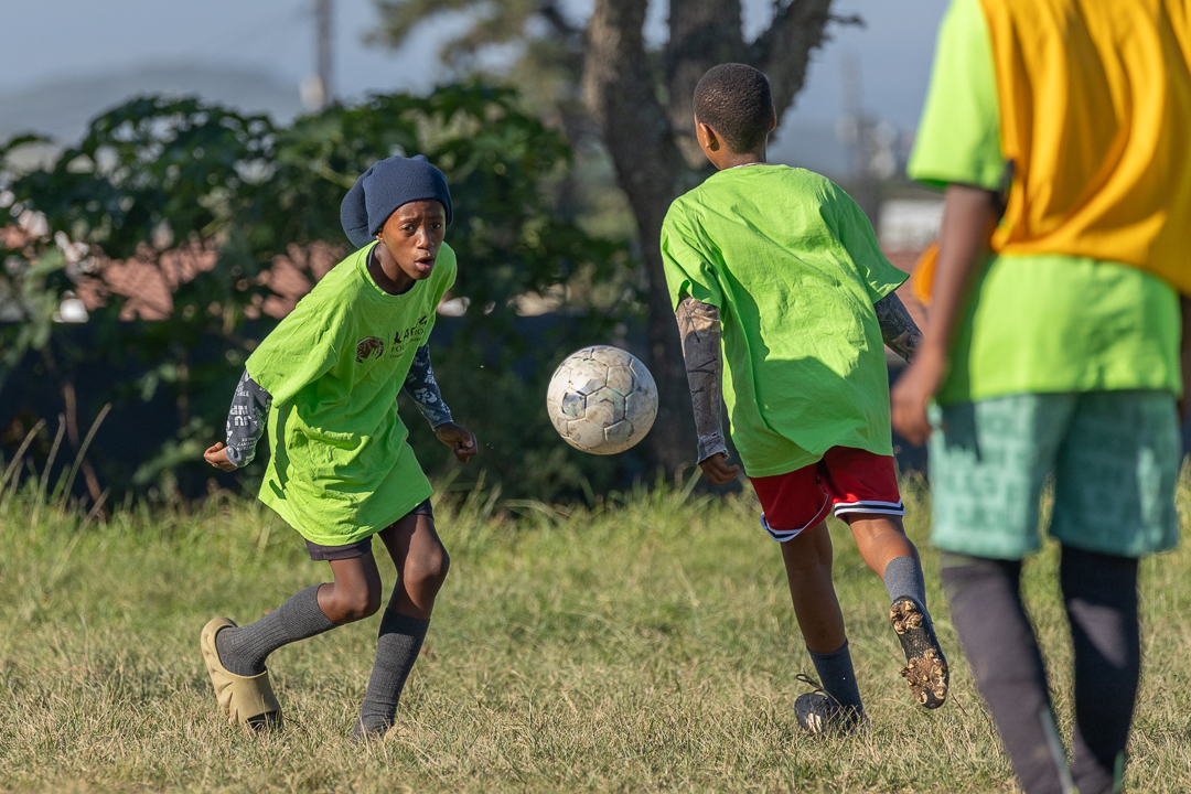 Children playing soccer - sports development